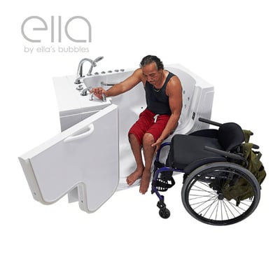 Wheelchair user transferring from his wheelchair into an Ella walk-in tub with an open outward swing door