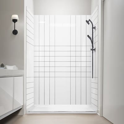 Ella Verti Grid acrylic shower stall with white tile-pattern walls, black sliding handheld showerhead, and low-threshold base