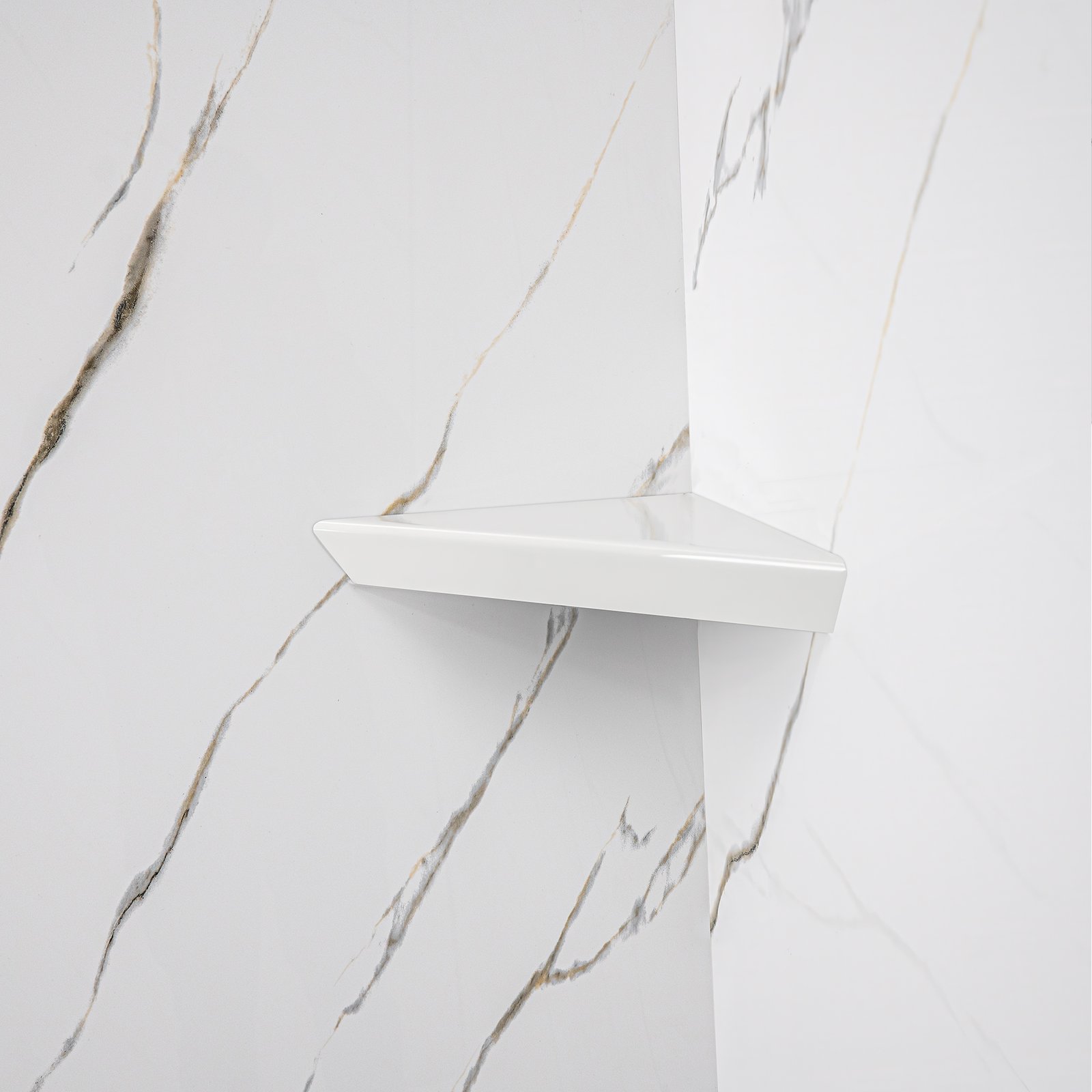 Calacatta Gold, Walk-In Tub Surround Wall Kit 40" x 48" x 60" - %3E - Close-up of a white corner shower shelf mounted on Calacatta Gold acrylic shower wall panels with gold veining