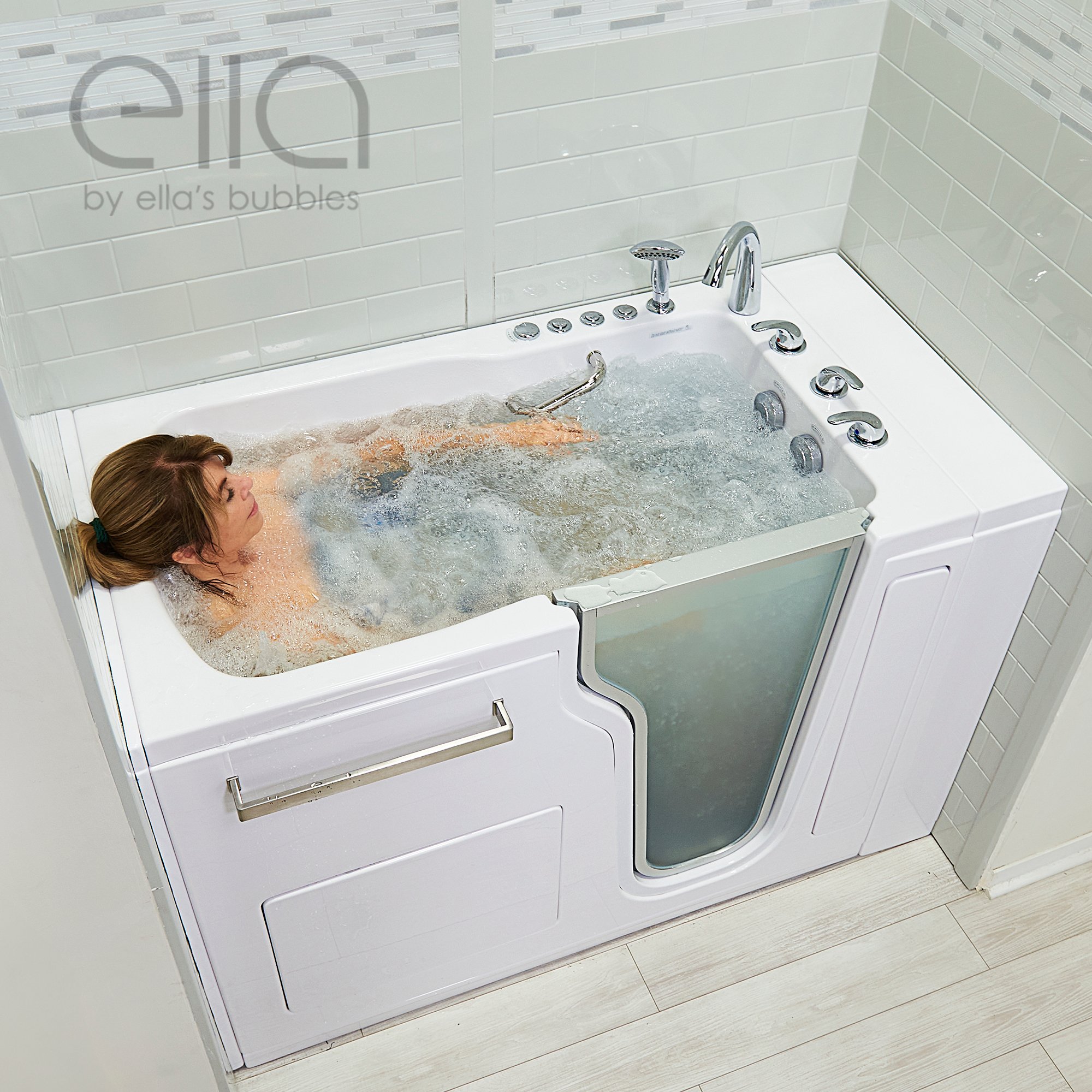 Woman relaxing eyes closed in an Ella walk-in tub with bubbling hydro massage jets and chrome faucet set