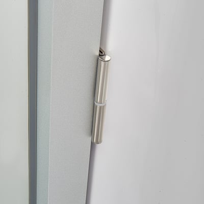 Close-up of a polished chrome hinge on a frosted glass shower door panel for an Ella accessible shower stall