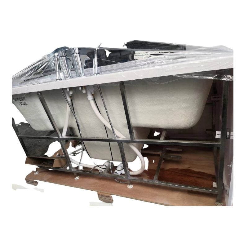 Ella two-seat walk-in tub crated in its metal frame with plastic wrap and chrome faucet fixtures ready for shipping