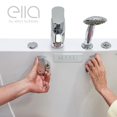 Senior's hands adjusting the drain lever and water controls on an Ella's Bubbles walk-in tub with chrome faucet and handheld shower