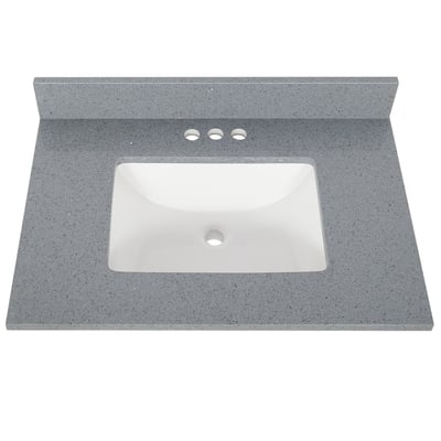 Gray speckled quartz vanity top with white rectangular undermount sink and three faucet holes centered