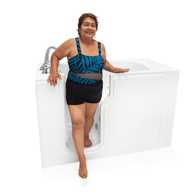Senior woman stepping into an Ella walk-in tub through the open side door over the low threshold