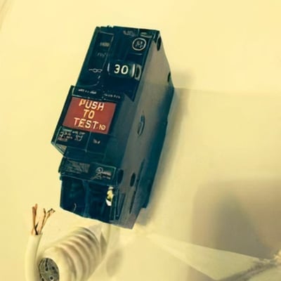 30-amp GFCI circuit breaker with red Push to Test button and wiring for walk-in tub electrical installation