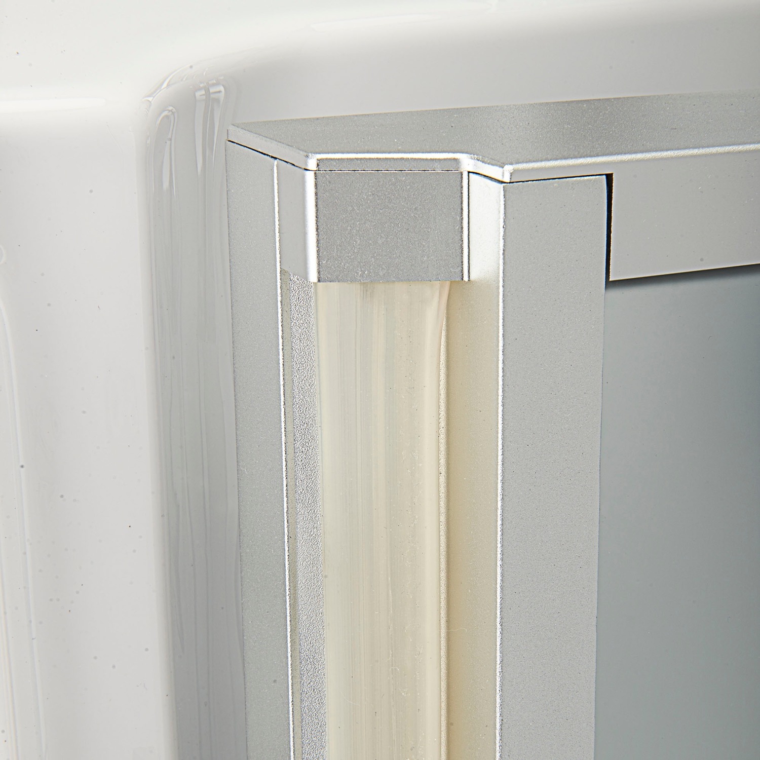 Close-up of the watertight door seal and aluminum frame corner on an Ella Ultra walk-in tub
