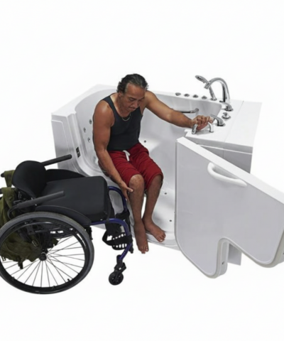 Man completing his slide from wheelchair onto the Ella transfer tub bench, holding the deck rail
