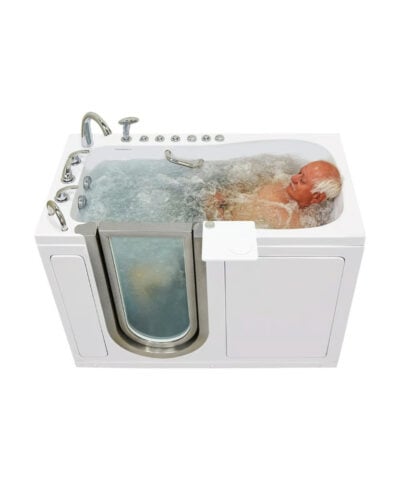 Angled view of a man reclining in a bubbling Ella Deluxe walk in tub with left hand chrome fixtures