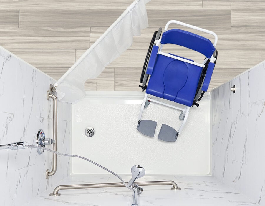 Overhead view of a wheelchair accessible roll-in shower with turning space, grab bars and handheld showerhead